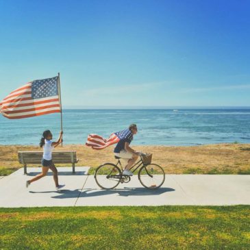 woman running holding an american flag